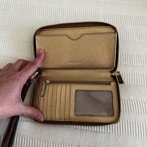 Gold Michael Kors zip around wallet/ wristlet